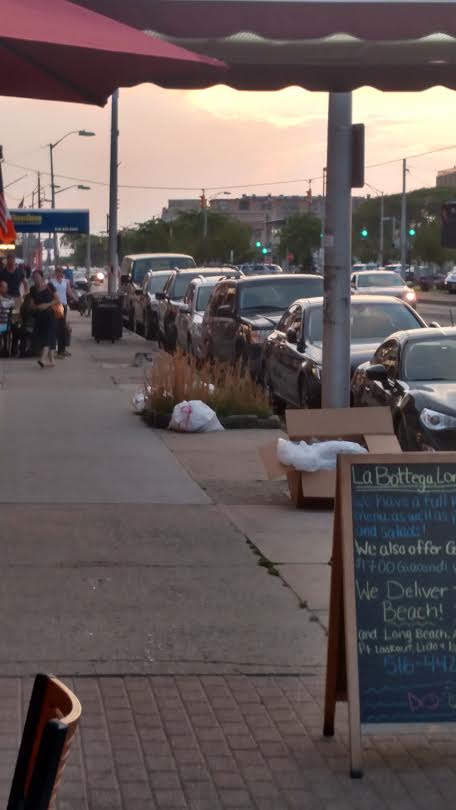 dinner time & garbage. Park Avenue, Long Beach, NY.
